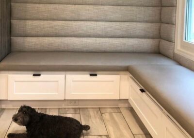 a cutstom banquette with a dog sitting in front