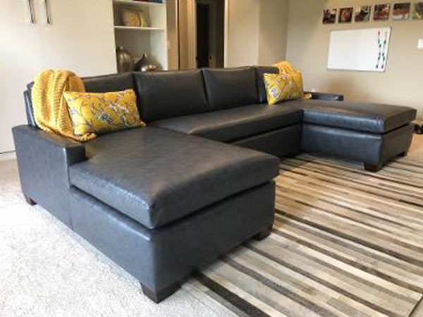 two upholstered chairs on either side of a fireplace