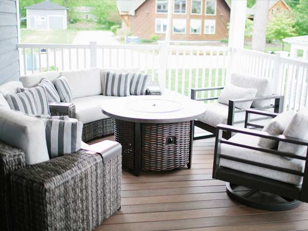 A white and wicker outdoor furniture set