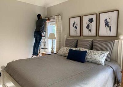 Installation of window treatments in a bedroom